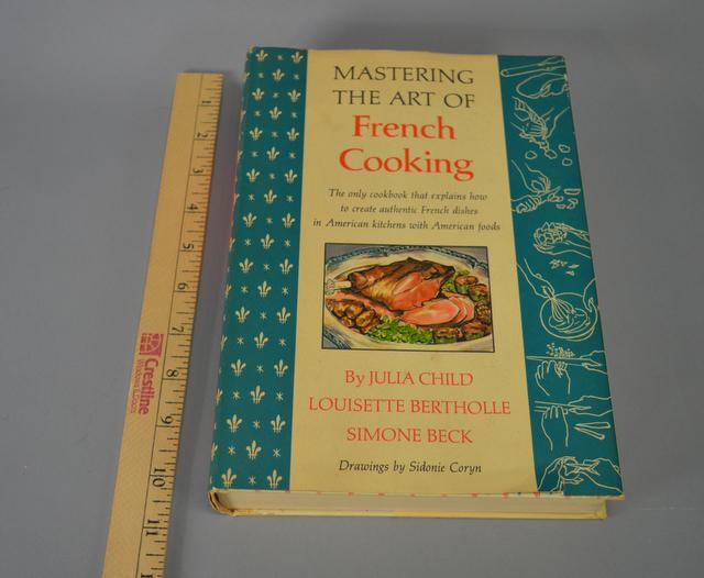 17th Printing Mastering The Art Of French Cooking: A 17th printing edition (1968) of Julia Child's "Mastering The Art Of French Cooking." Original dust jacket. Good condition. Previous owner's name in ink on front endpage. Please review the images for