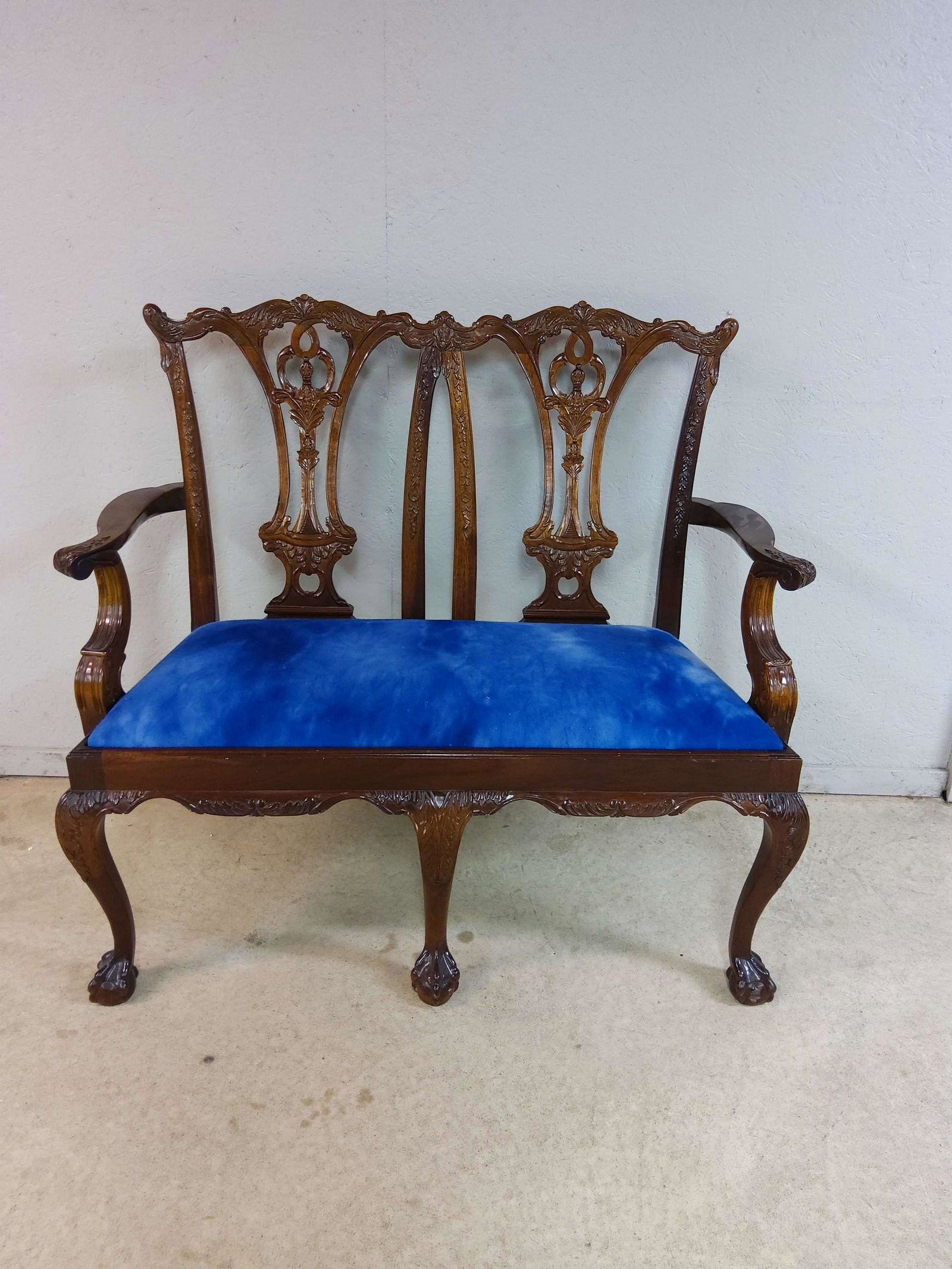 Chippendale Style Settee: A Chippendale style settee. Dimensions: 40.5 inches high x 44 inches x 19.5 inches deep.
