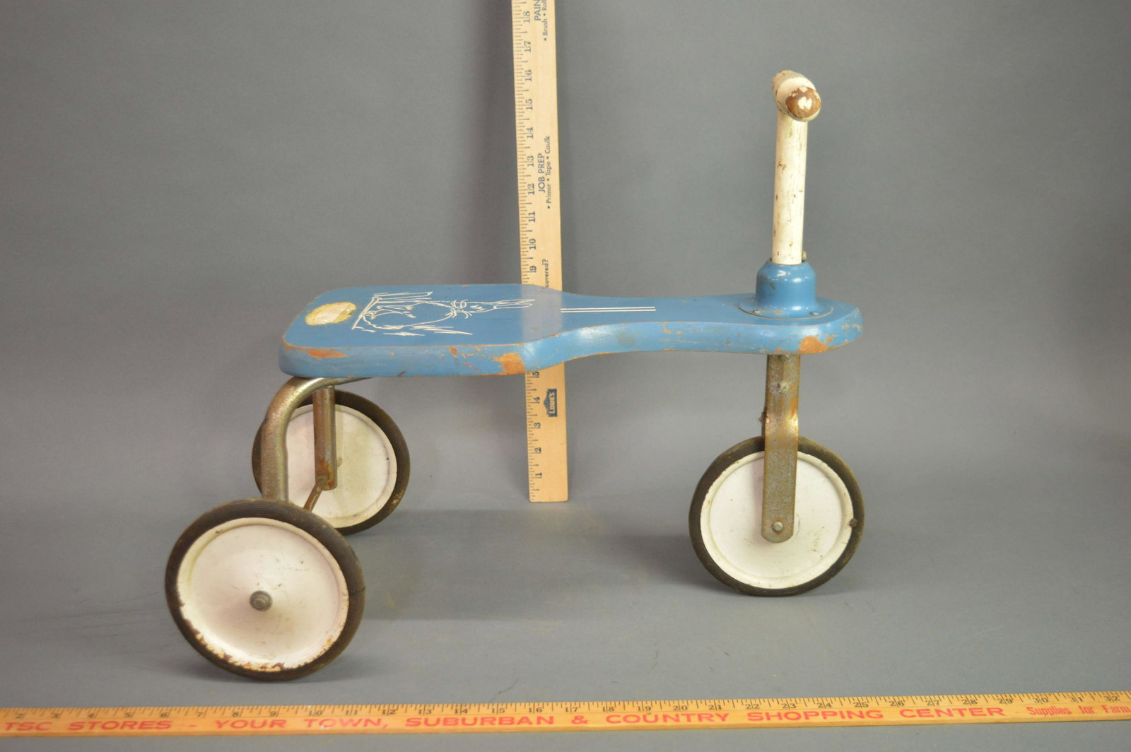 Vintage Wood & Metal Riding Toy: A vintage wood and metal riding toy.