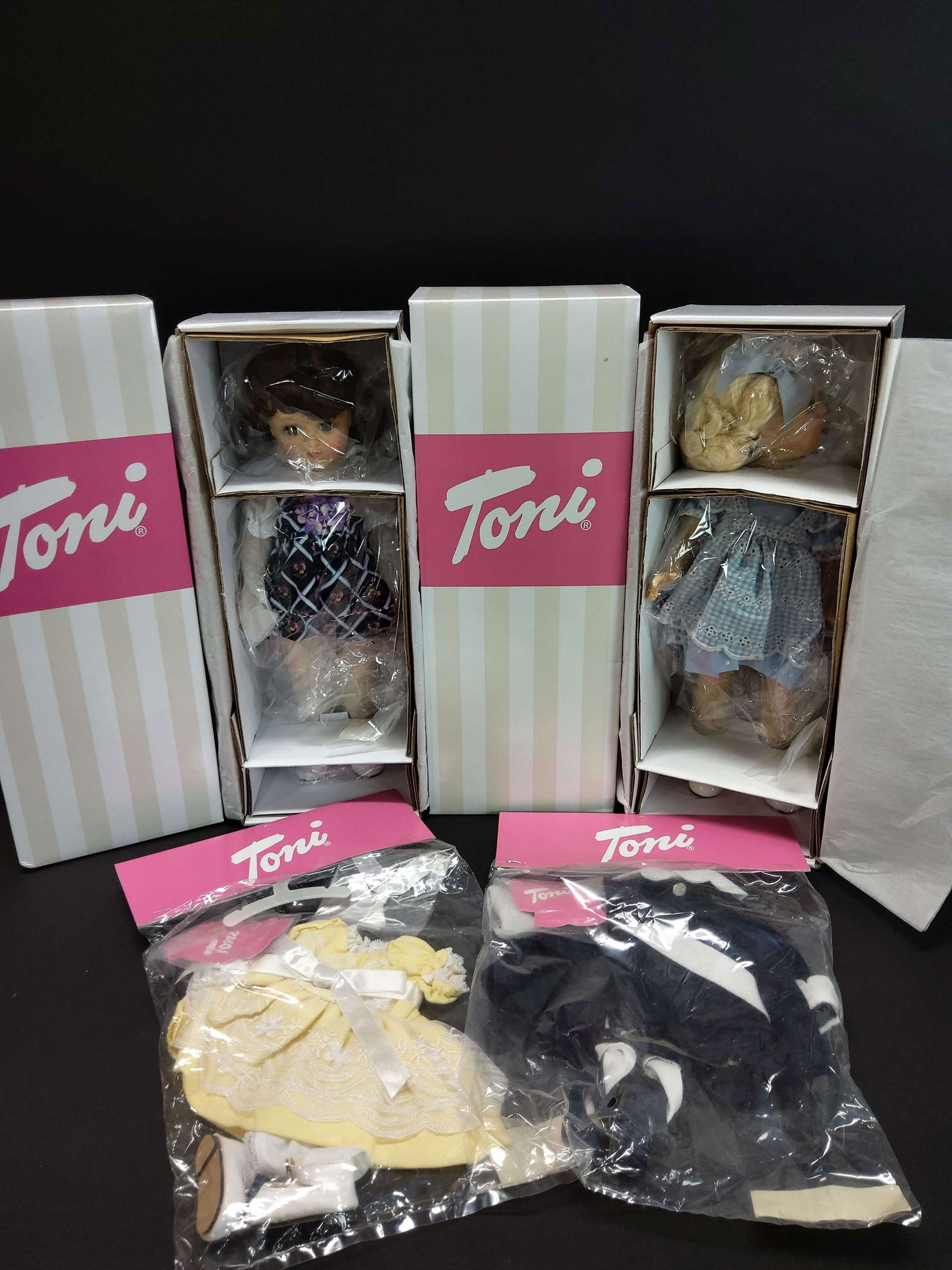 2 Effanbee Toni Dolls & 2 Toni Clothing Sets: 2 Effanbee Toni dolls, including "Tea Time Toni" and "Very Violet," together with 2 Toni clothing sets.