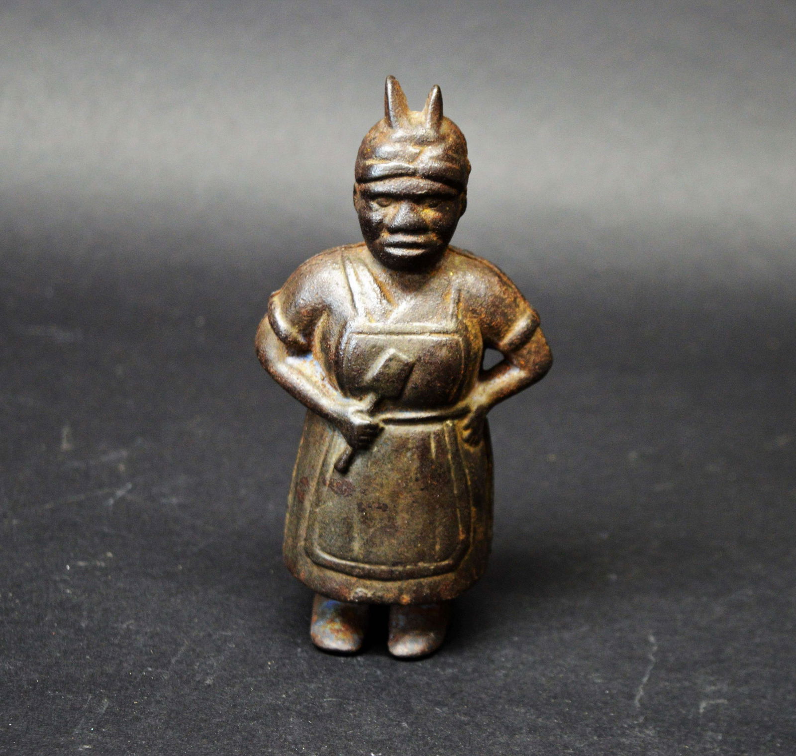 Black Americana Cast Iron Still Bank: A Black Americana cast iron still bank.