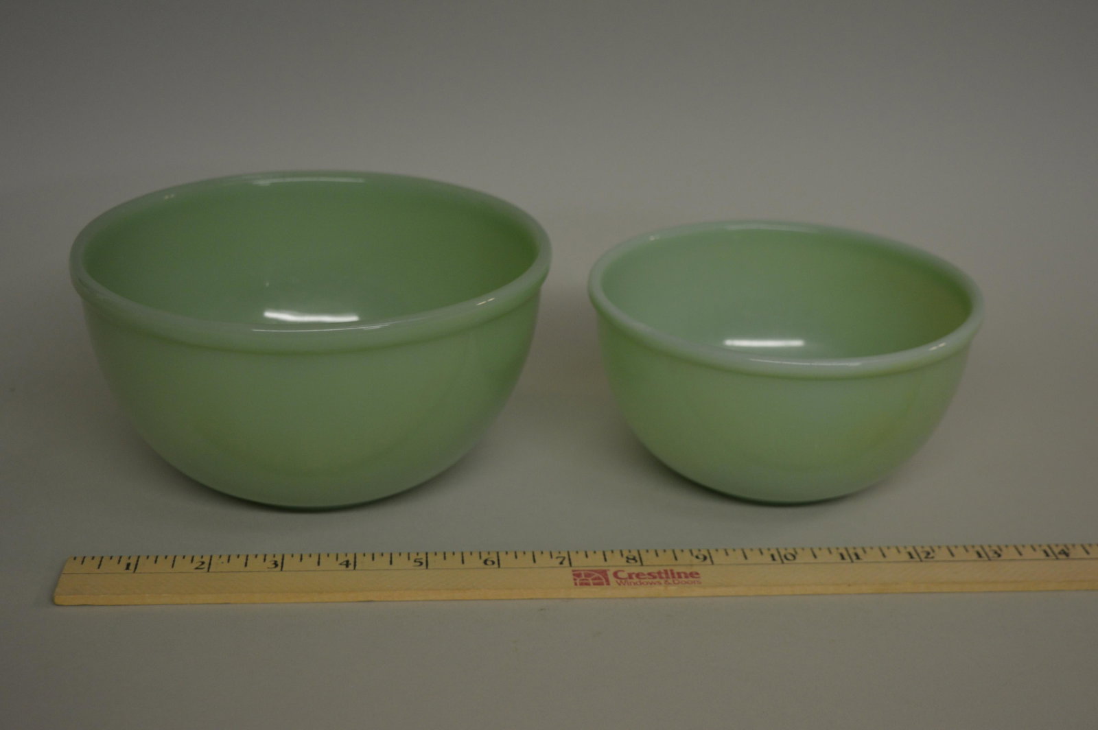 2 Fire King Jadeite Beaded Edge Mixing Bowls: Two Fire King Jadeite beaded edge mixing bowls.