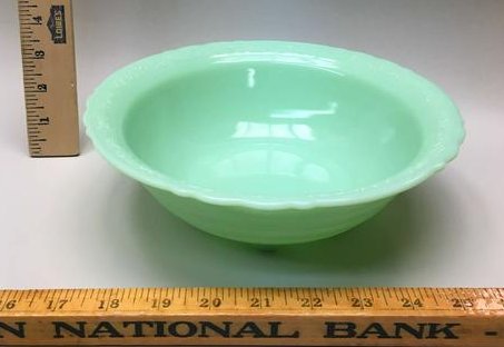 McKee Flower Band Jadeite Footed Bowl: A McKee "flower band" jadeite footed bowl. 9-3/8" diameter.