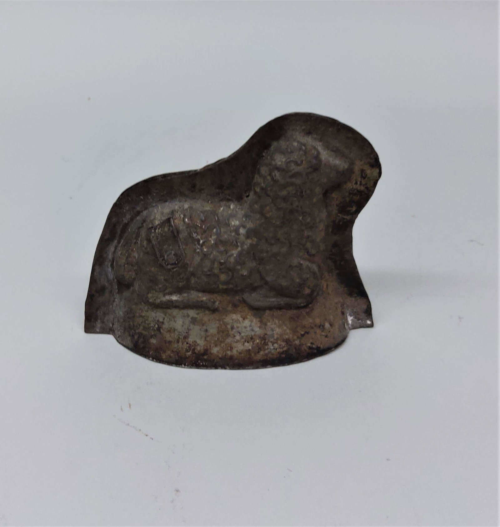Antique Tin Lamb Chocolate Mold: An antique tin lamb chocolate mold.