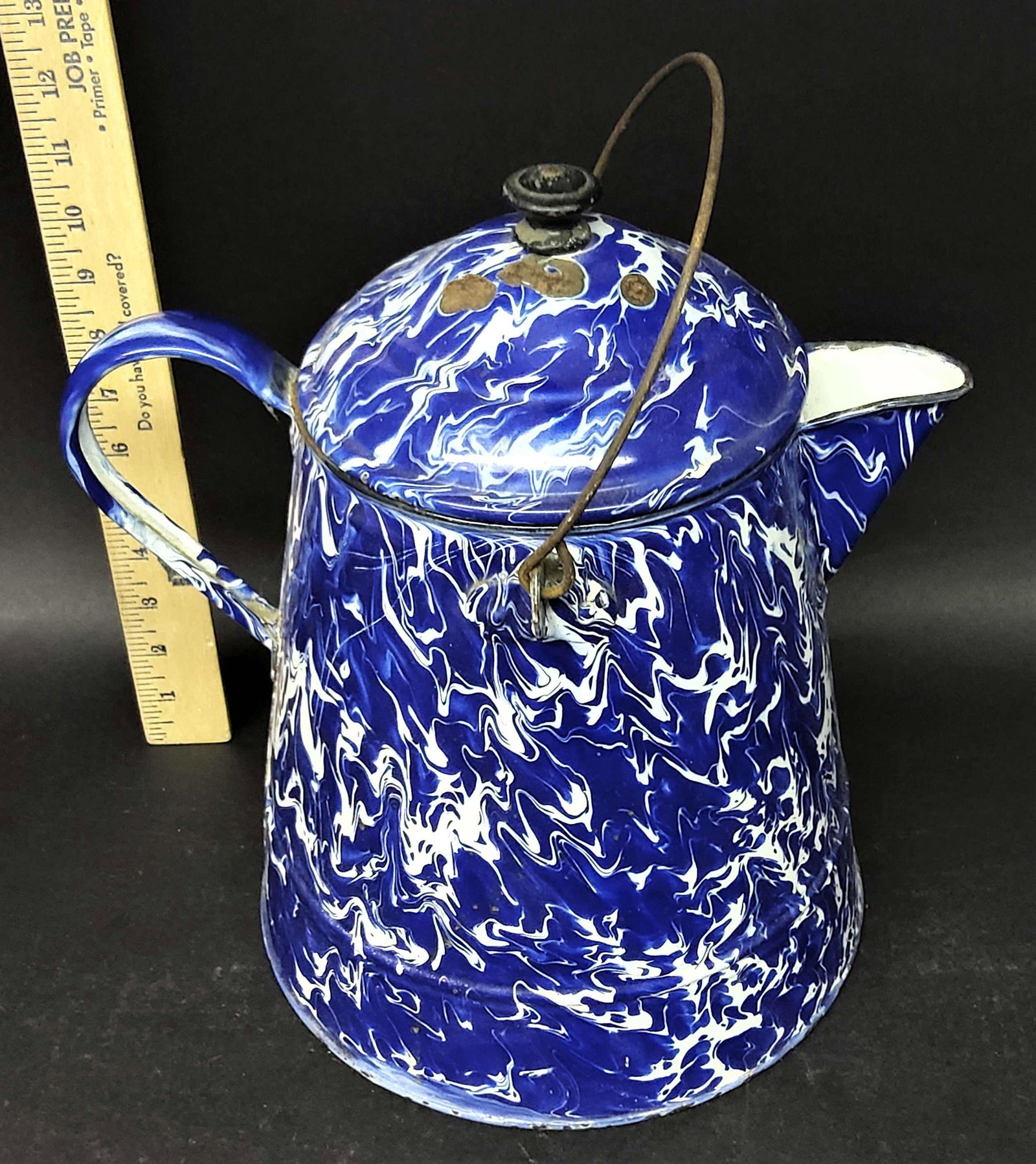 Antique Graniteware Coffee Pot: An antique graniteware coffee pot.