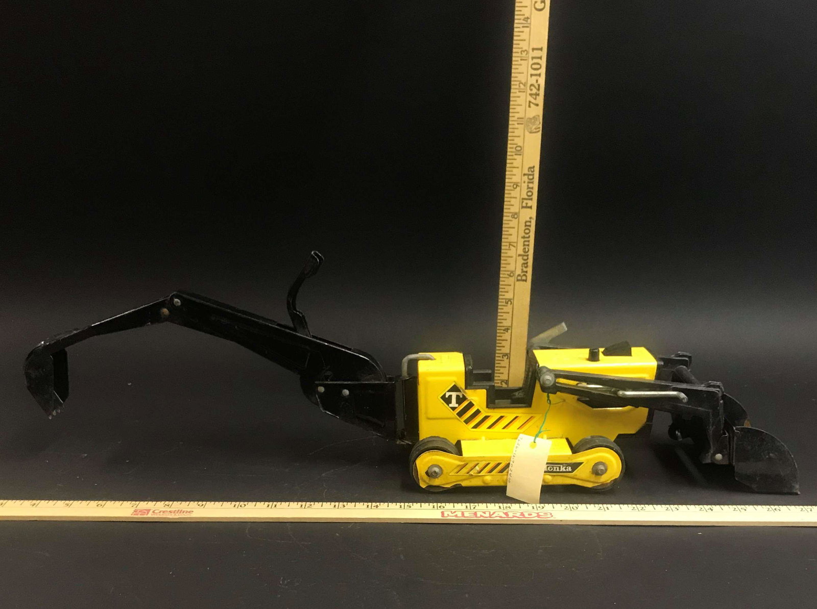 Tonka Back Hoe Trencher: A Tonka back hoe trencher.