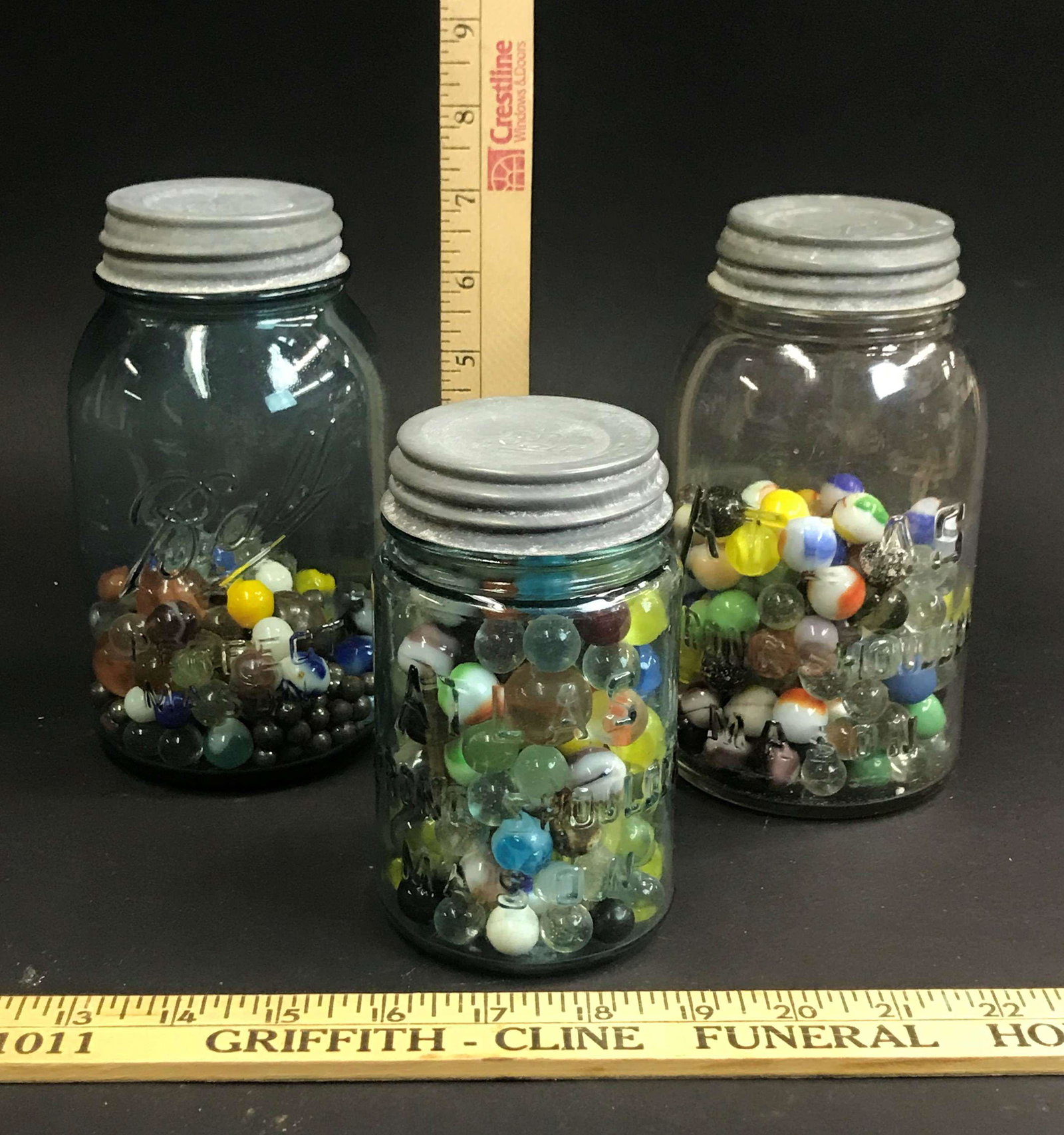 3 Canning Jars of Glass Marbles: 3 canning jars containing glass marbles.