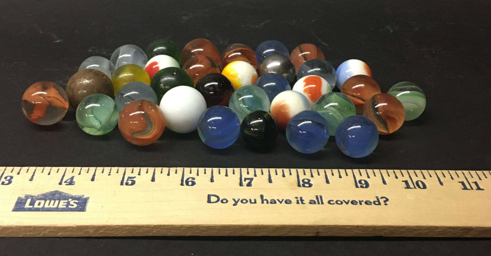 Lot of 34 Glass Shooter Marbles: A lot of 34 glass shooter marbles.