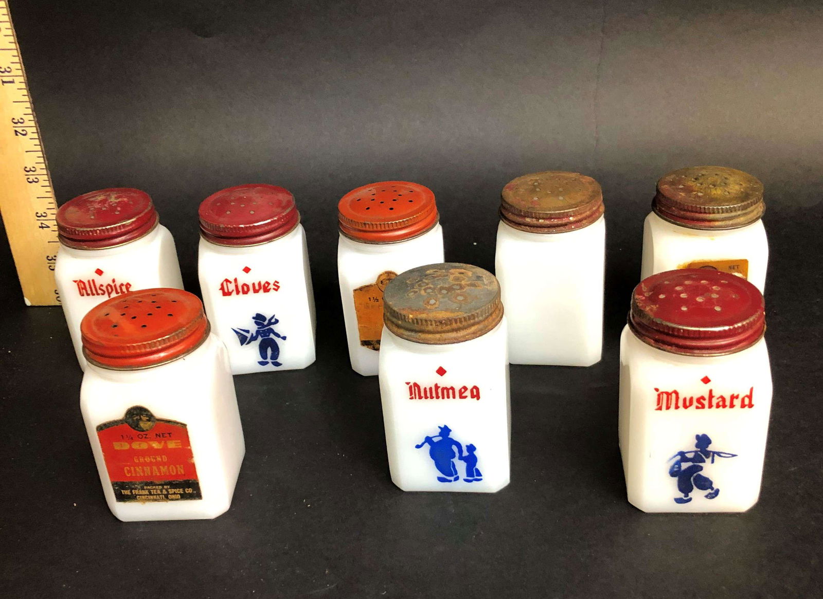 Set of 8 Vintage Dutch Theme Milk Glass Spice Shakers: A set of 8 vintage milk glass Dutch themed spice shakers, c.1930s.