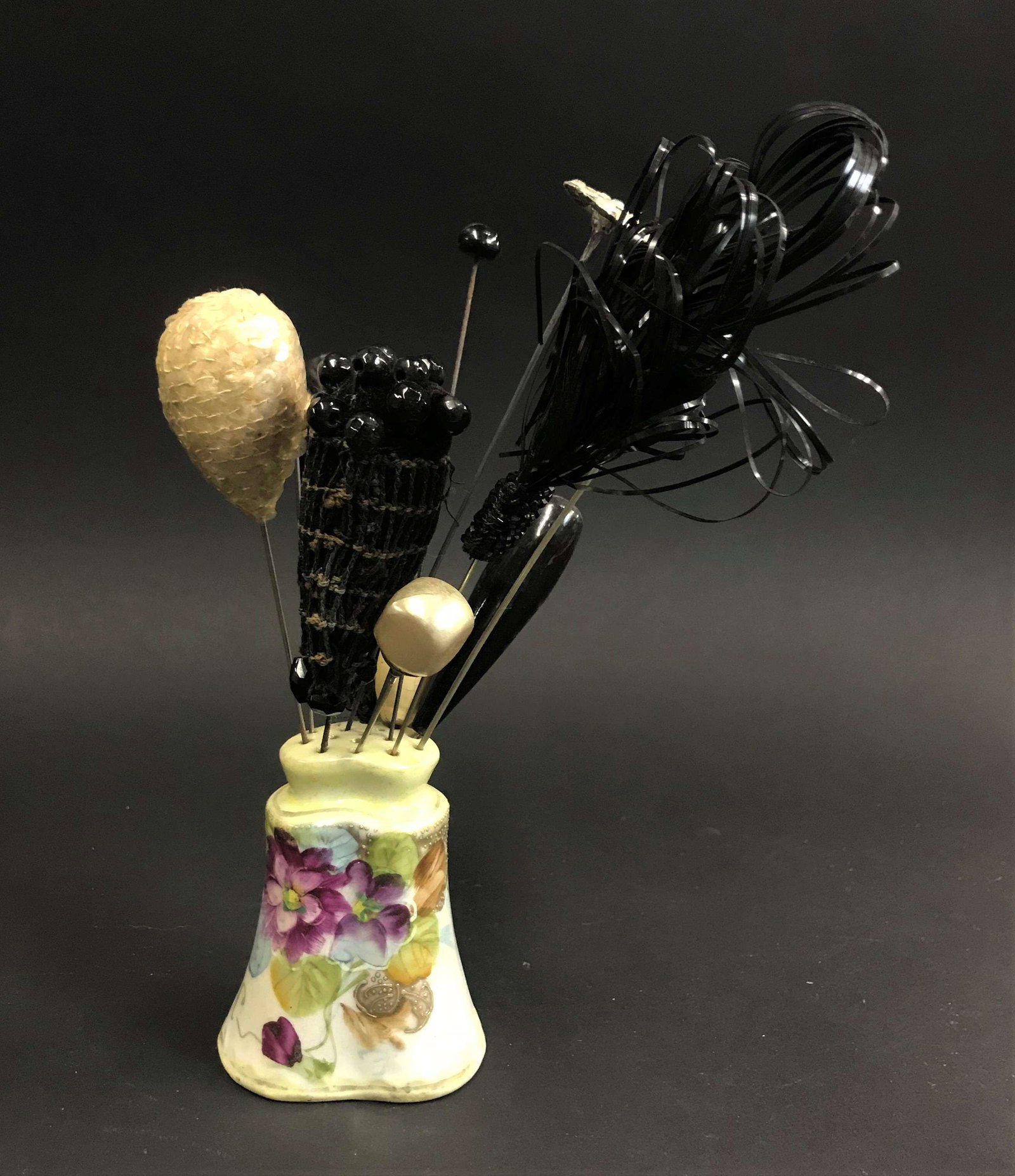 12 Victorian Hat Pins: A collection of 12 Victorian/Edwardian era hat pins, together with a Japanese export Porcelain Shaker.