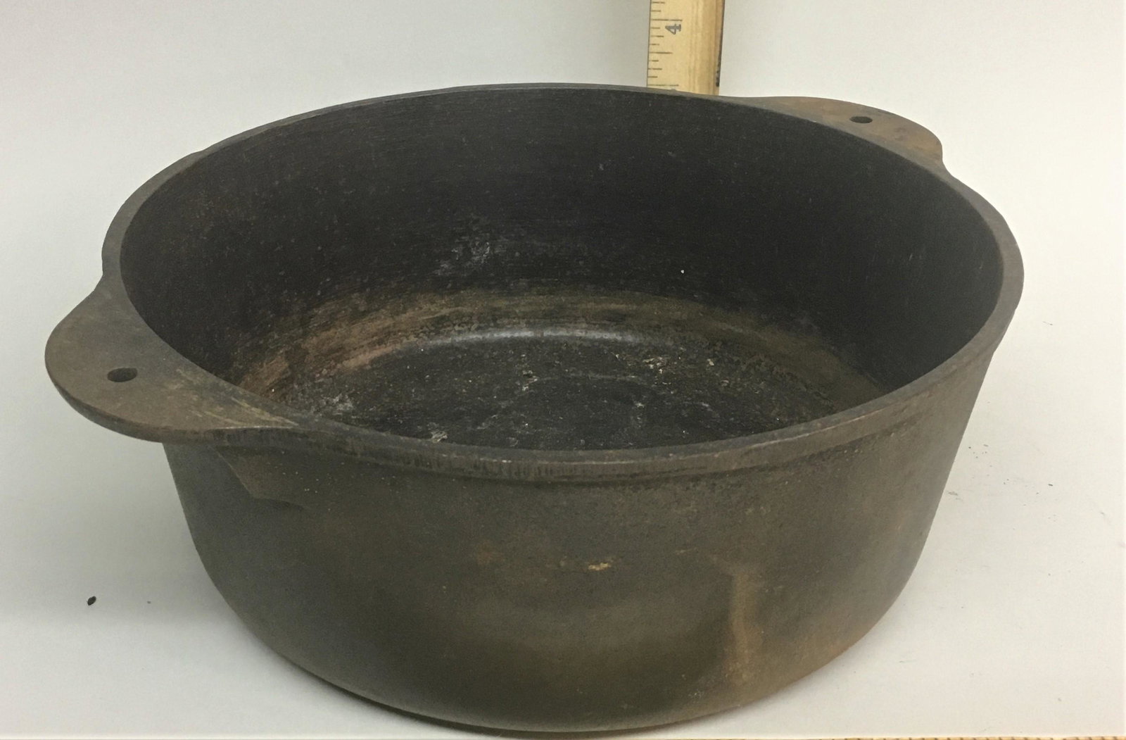 Griswold Cast Iron #8 Tite-Top Dutch Oven 1295: A Griswold cast iron #8 Tite-Top Dutch oven 1295, no lid or handle.