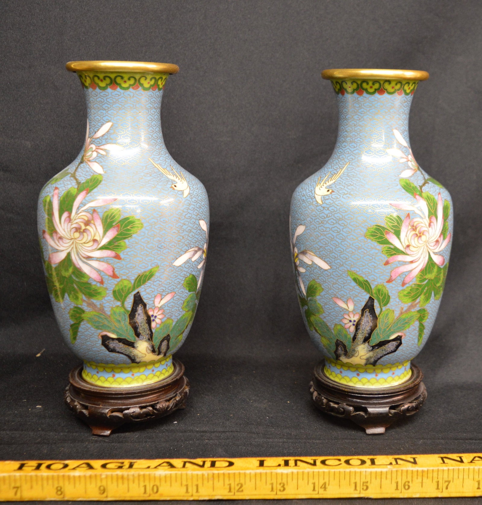 Pair of Chinese Cloisonne Vases: A pair of chinese cloisonne vases with wood stands.