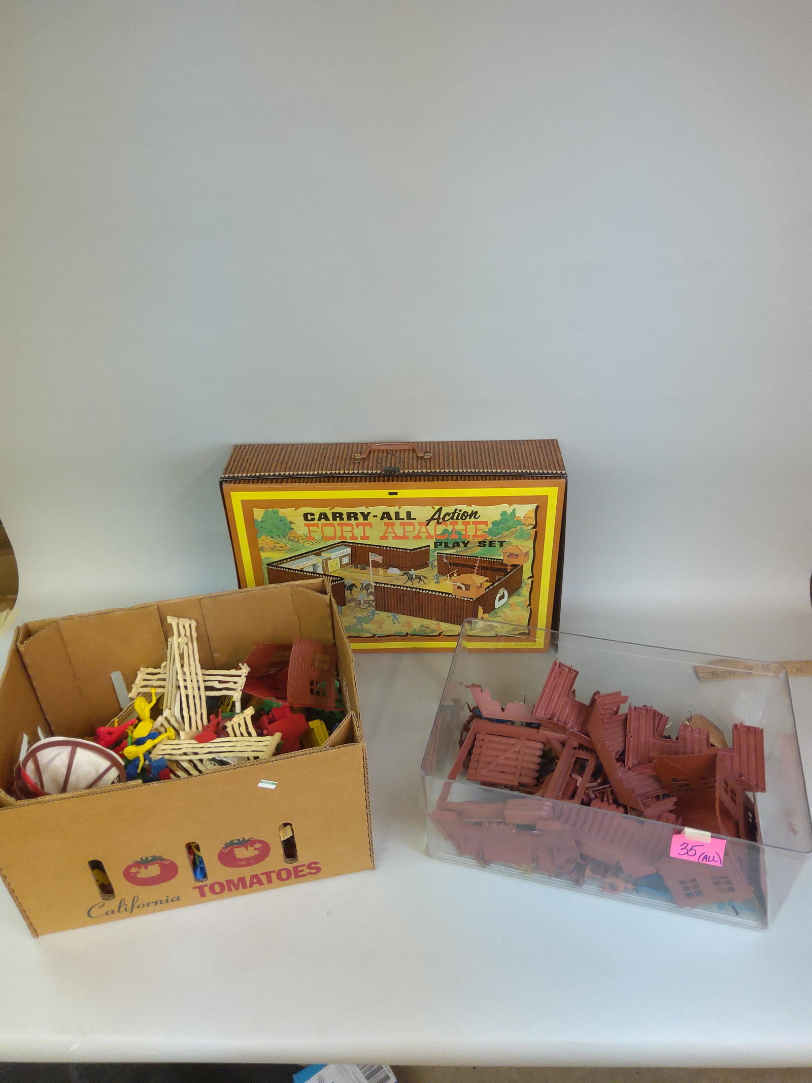 Group of Marx Cowboys & Indians Toys Fort Apache: A collection of Marx cowboys and Indians toys, including Fort Apache set.