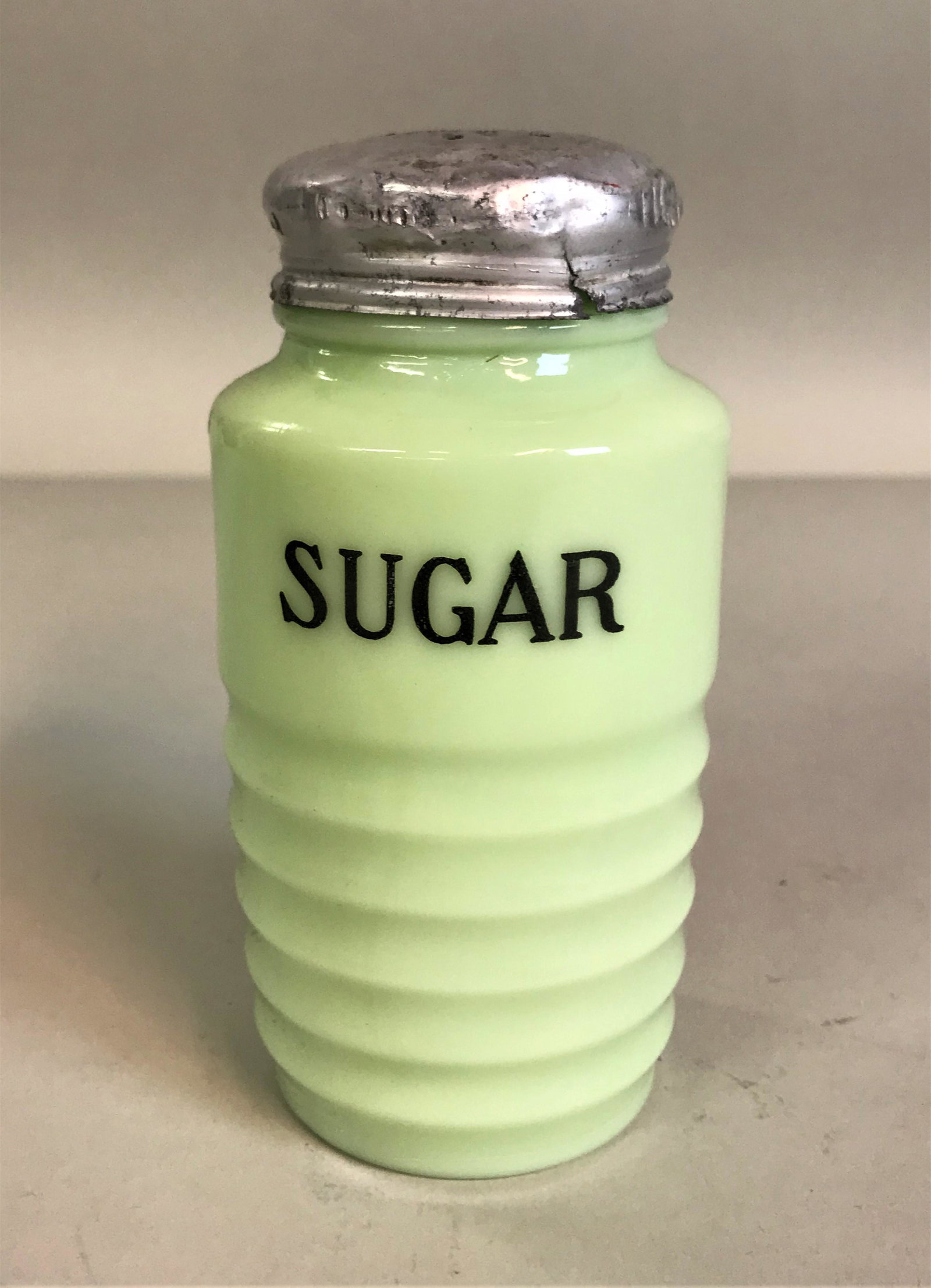 Vintage Jeannette Jadeite Glass Sugar Range Shaker: A vintage Jeanette jadeite glass sugar range shaker.