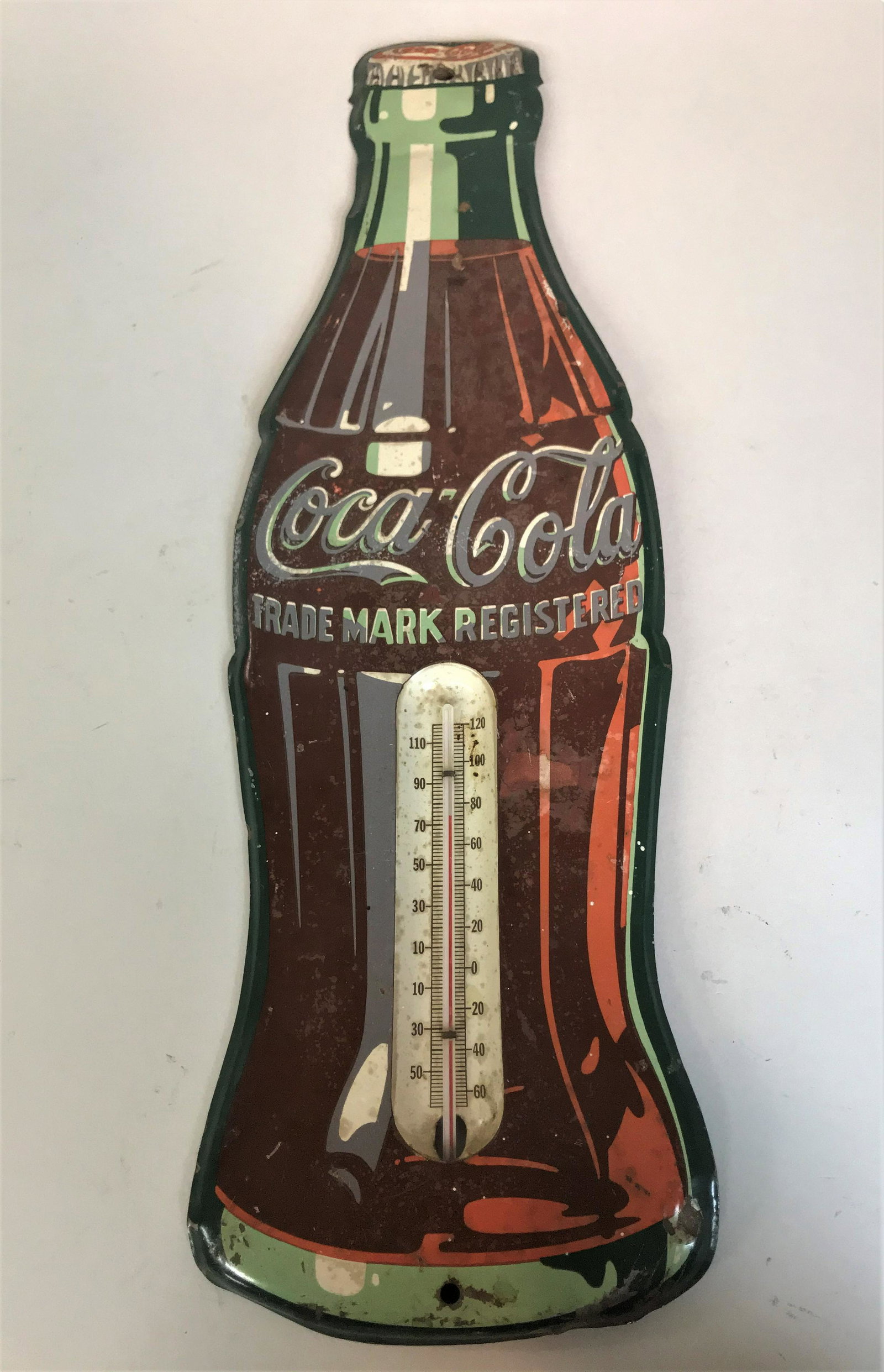 Vintage Tin Litho Coca-Cola Thermometer: A vintage tin litho Coca-Cola thermometer.