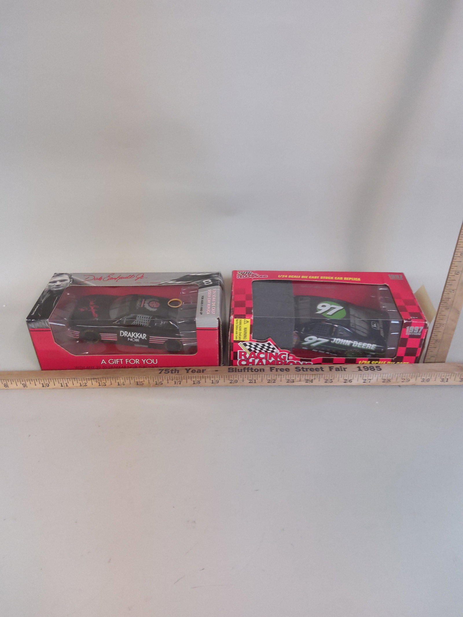 2 Diecast Race Car Models NASCAR John Deere & Drakkar: 2 Diecast race car models including Racing Champions NASCAR John Deere & Dale Earnhardt Jr. Drakkar Noir.