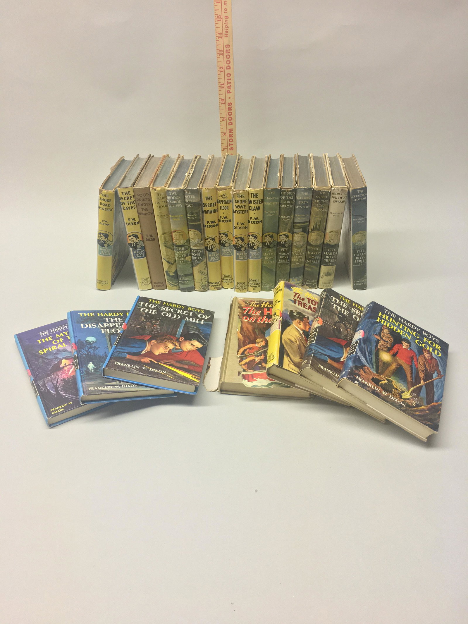 Collection of 23 Hardy Boys Books Grosset & Dunlop: 23 vintage Grosset & Dunlap "Hardy Boys" volumes, circa 1930s-1960s. Most have their original dust jackets. Fair to Very Good condition. Some missing jackets or with torn jackets. Some writing on end 