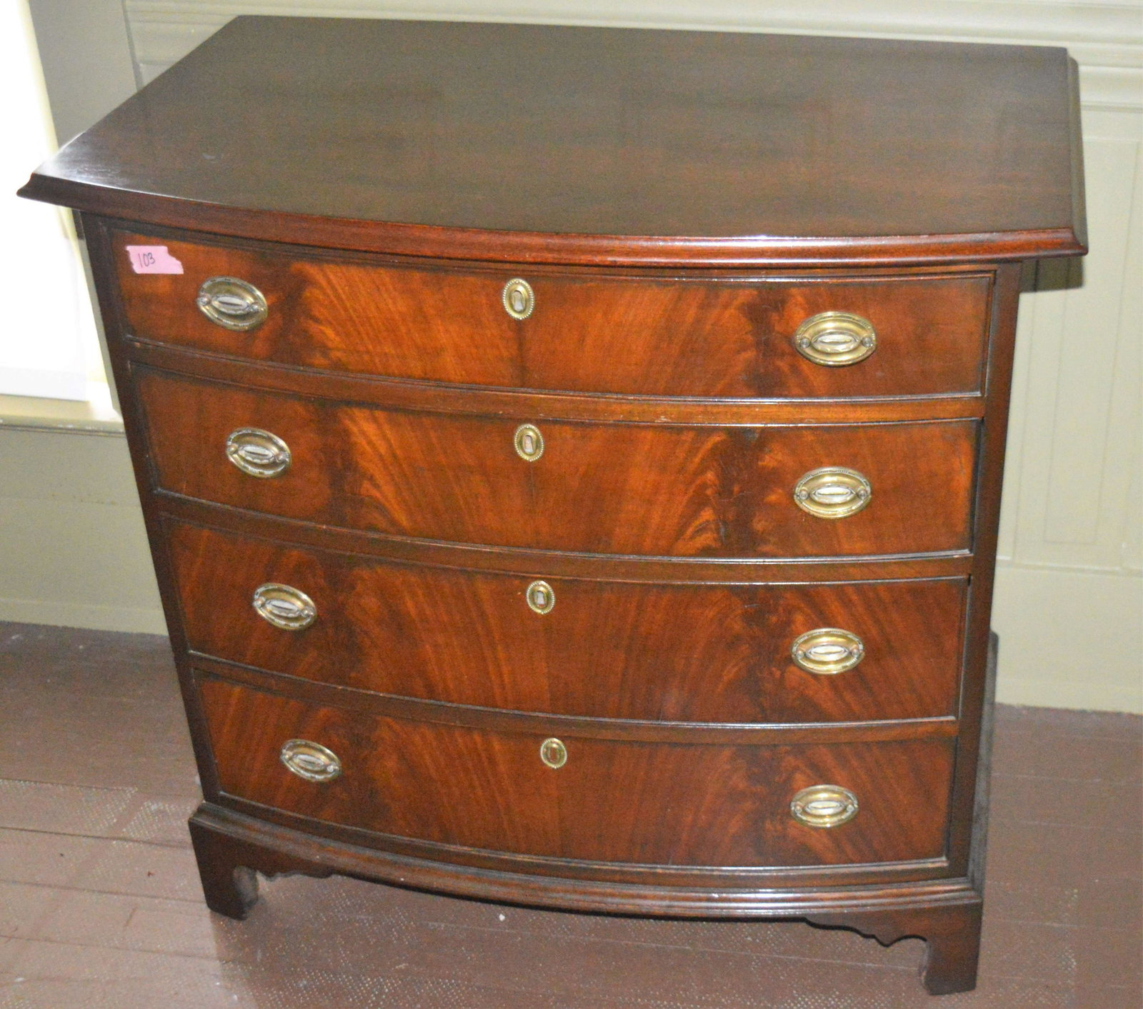 Hepplewhite style bow front mahogany chest of drawers.: Hepplewhite style bow front mahogany chest of drawers. Please review the images. Dimensions: 33.75" high x 35.5" wide x 22" deep.