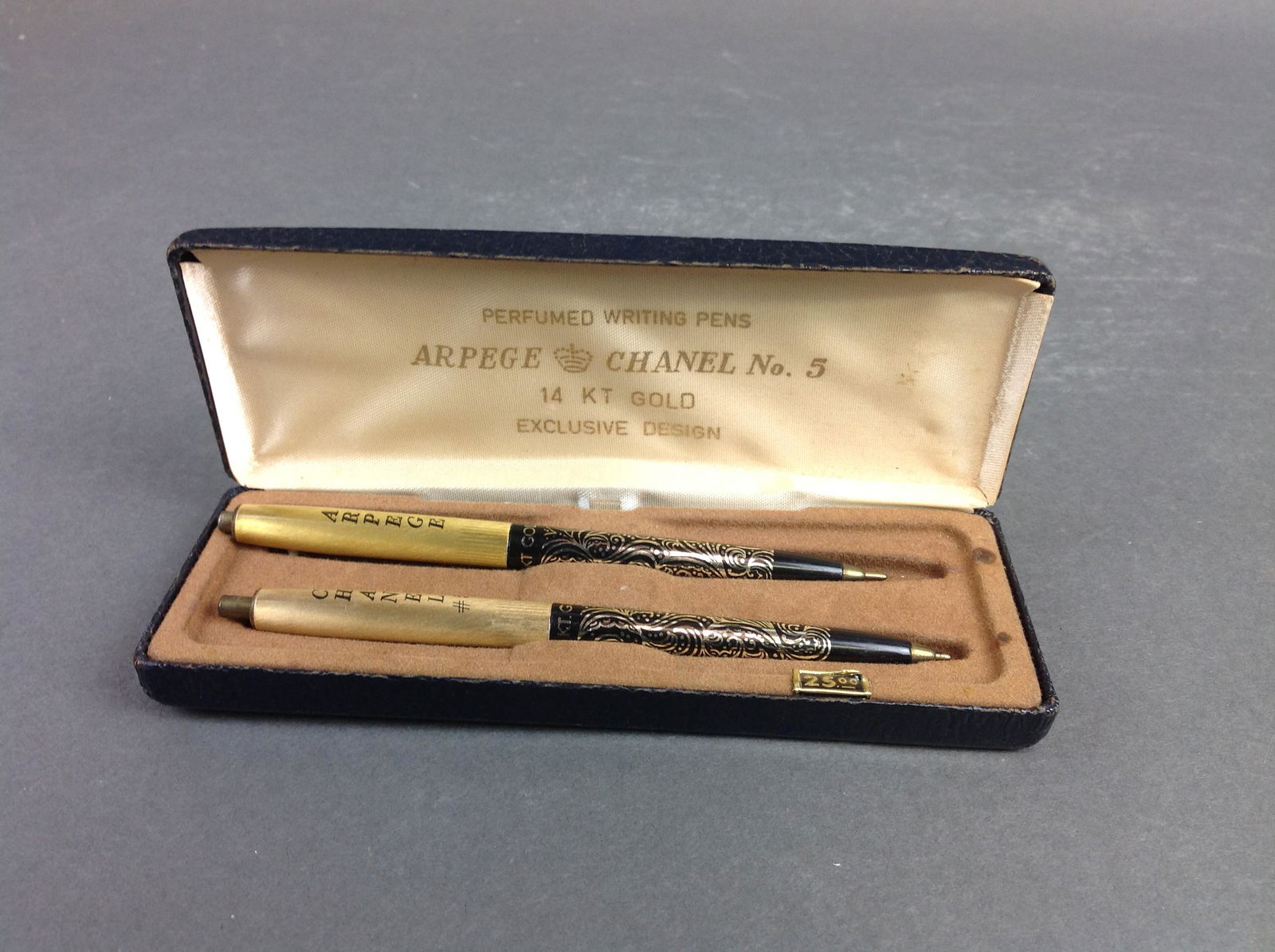 Arpege Chanel No. 5 perfumed writing pens: With 24k gold filigree inlay. Pens are stuck and won't close. Please review the images for condition and dimensions.