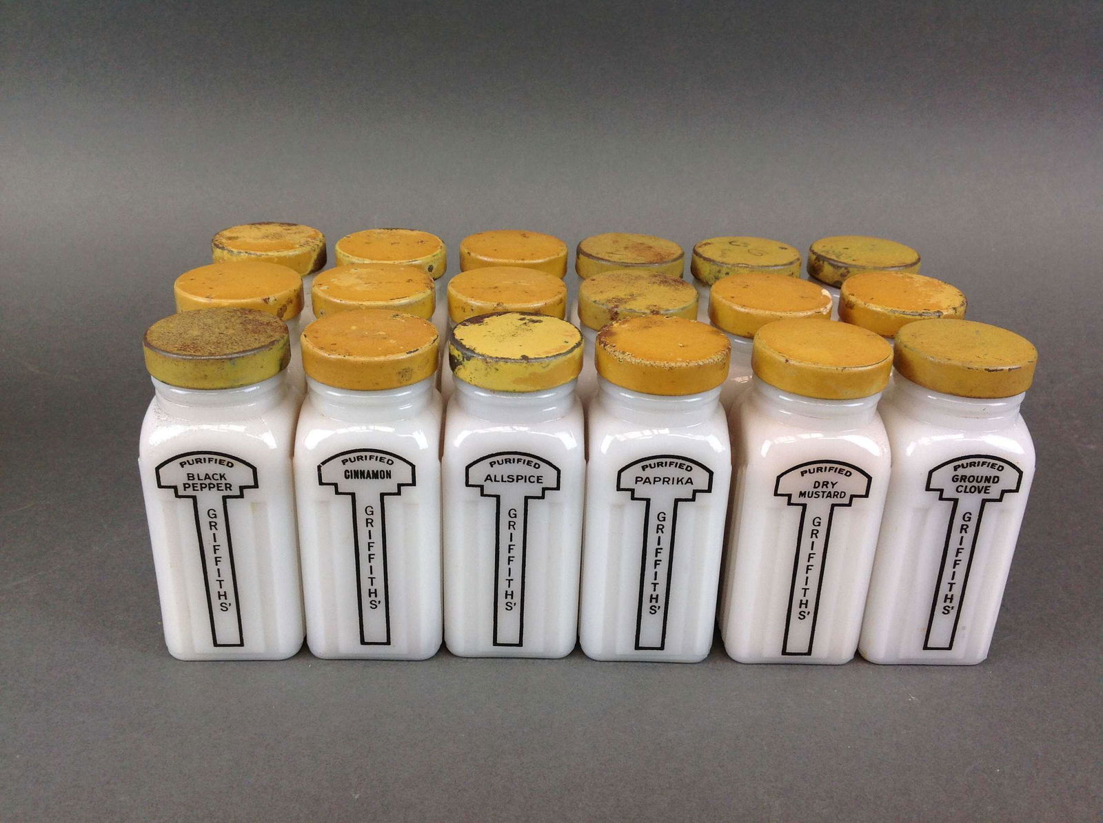 18 Pc Art Deco Milk Glass Spice Set: An 18 piece Art Deco milk glass spice set, Griffith Laboratories Chicago.