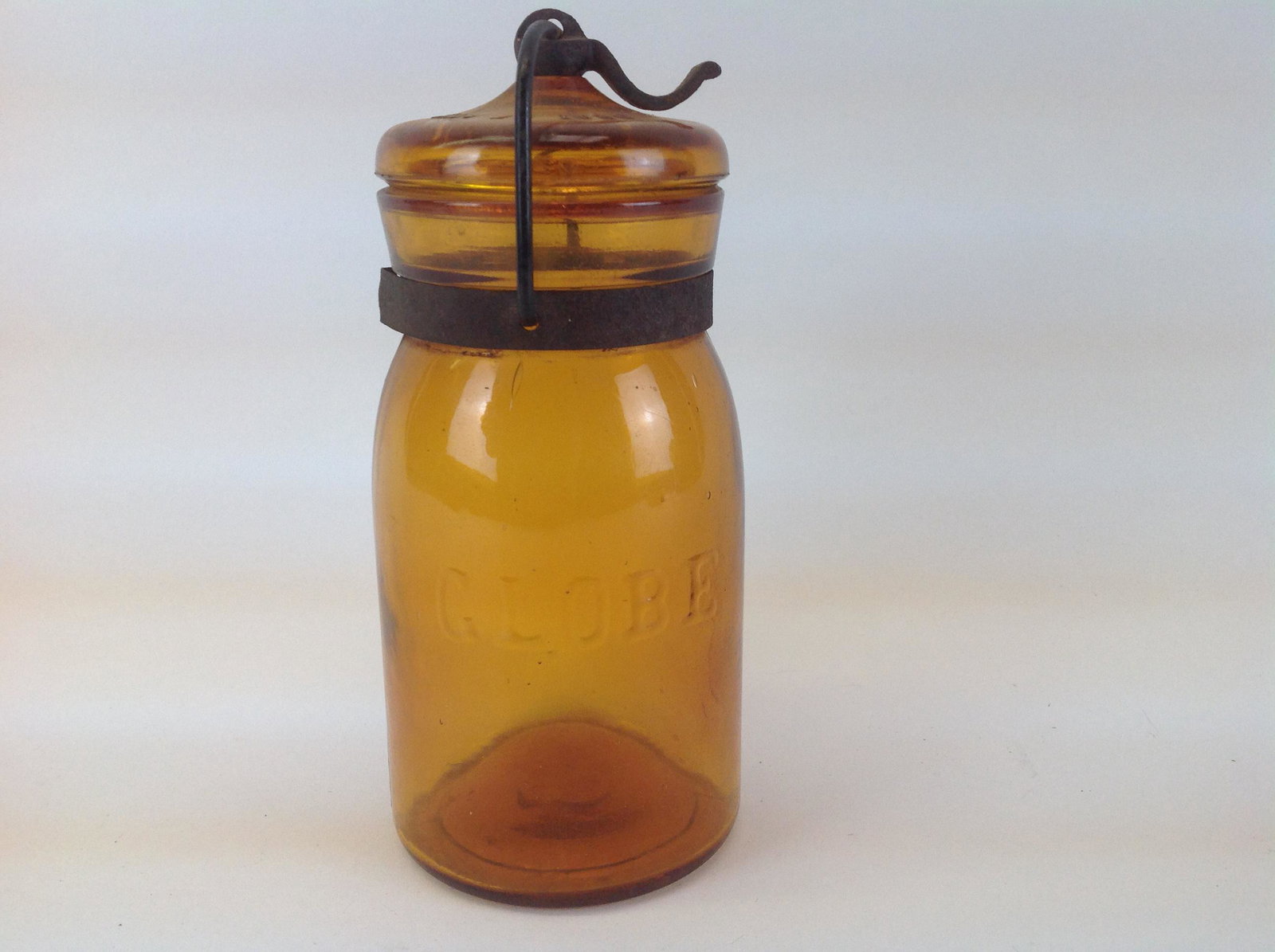 Globe Amber Glass Canning Jar: A Globe amber glass canning jar