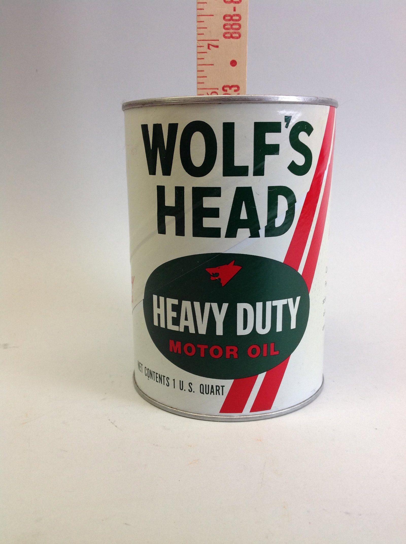 Wolf's Head Heavy Duty Motor Oil 1 Quart Can: A Wolf's Head Heay Duty Motor Oil one quart paper can, full.
