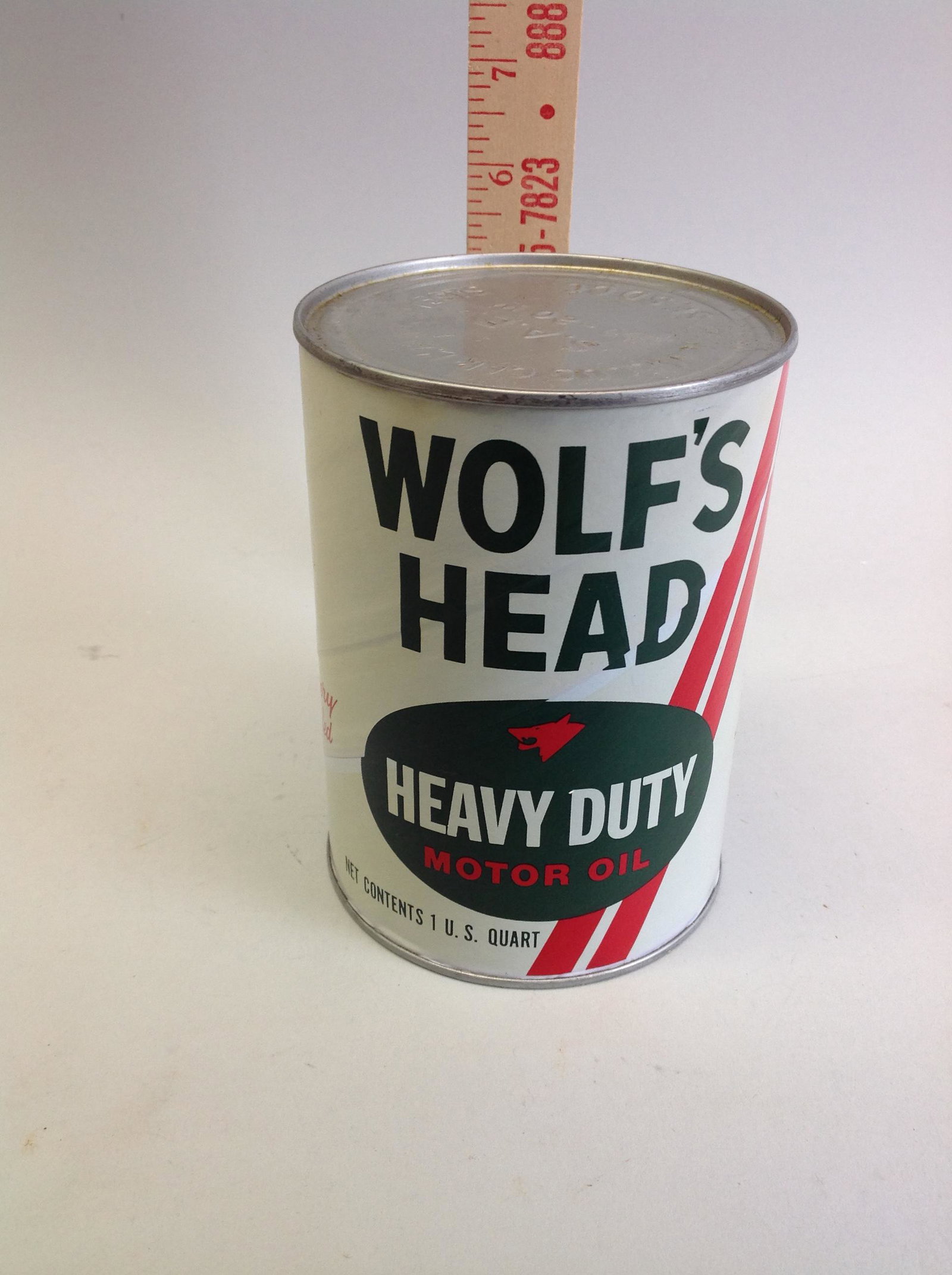 Wolf's Head Heavy Duty Motor Oil 1 Quart Can: A Wolf's Head Heay Duty Motor Oil one quart paper can, full.