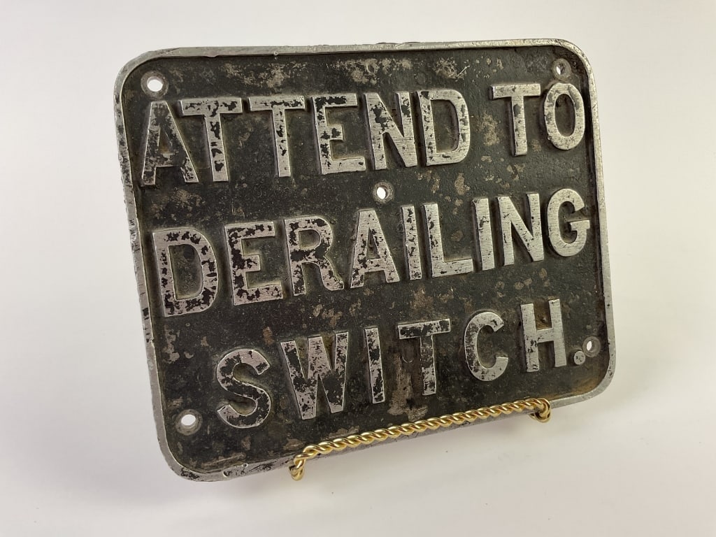Railroad Attend To Derailing Switch Metal Sign: Railroad Attend To Derailing Switch Metal Sign. 9-5/8 inches x 7-5/8 inches.