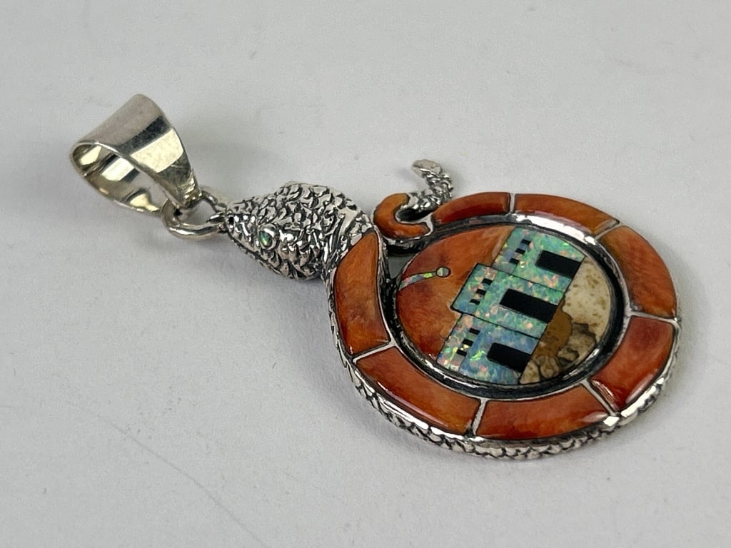 Sterling Pendant With Opal & Gemstones Snake: Philippines Sterling snake pendant with inset scenic reserve of opal and other gemstones. Total weight inclusive of all materials: 7.112 grams.