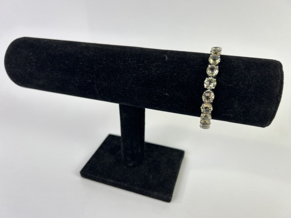 Sterling Silver & Pale Yellow Citrine Bracelet: A sterling silver and pale yellow citrine bracelet. Total weight inclusive of all materials: 18.131 grams.