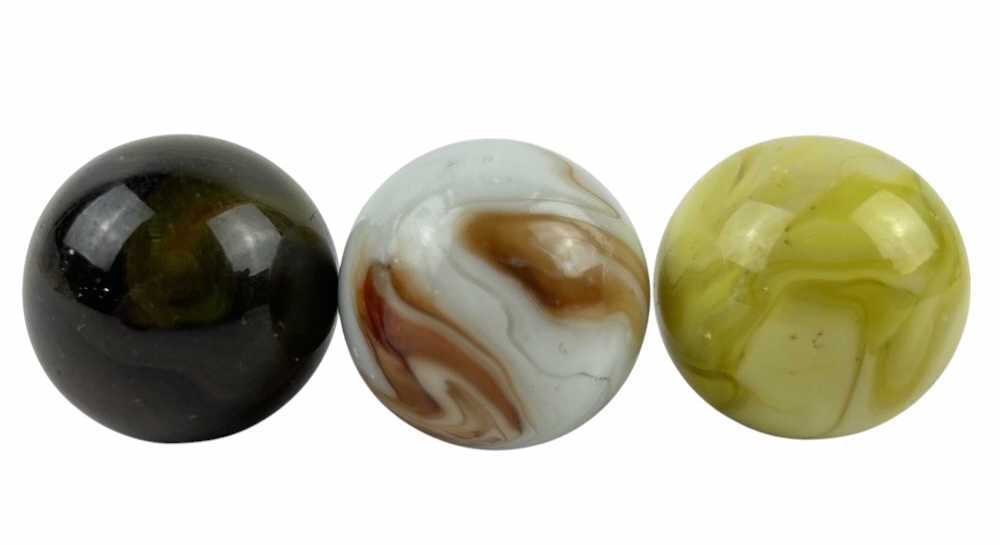 (3) Glass Glowing Shooter Marbles: (3) Glass Glowing Shooter Marbles each featuring unique swirls in colors such as red, orange, and yellow. Each marble has swirls that light up in blacklight. Each marble is around 1 in. around.