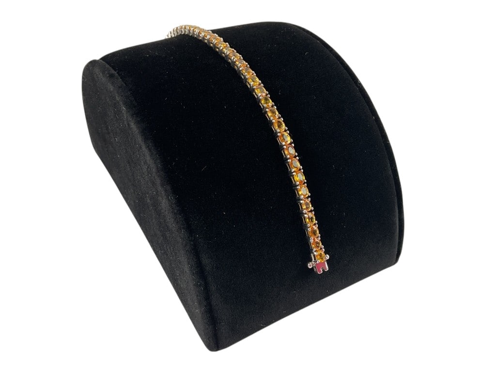 925 Sterling Silver Tennis Bracelet featurign Citrine Gemstones weighing 10.40 grams including: 925 sterling silver tennis bracelet featuring oval-cut citrine gemstones.