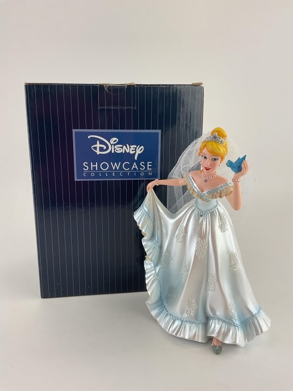 Cindrella Wedding Figurine Disney Showcase Collection: Item number 4045443. Contains one figurine. Figurine features white veil and blue bird. Original box is included. Box is 9.5"x6"x7.5".