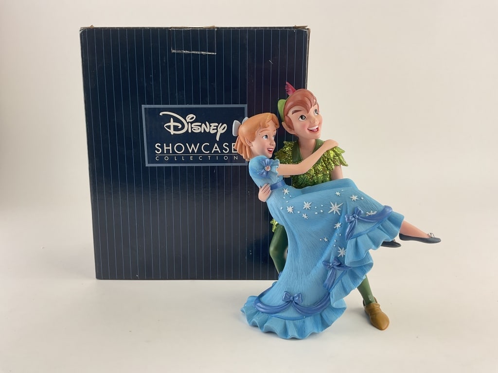Peter Pan and Wendy Darling Figurines: Disney Showcase Collection figurine by Enesco of Peter Pan and Wendy from Peter Pan. Item number 6010727. Original box included.