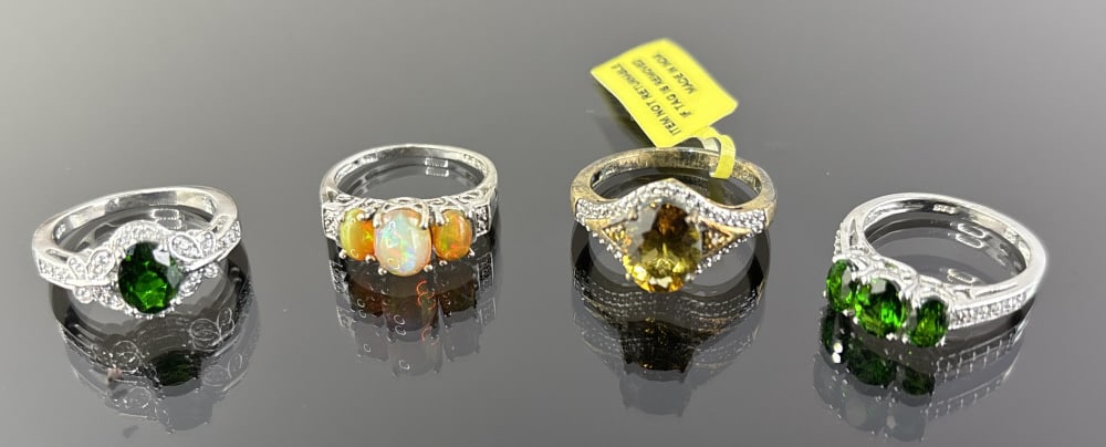 (4) 925 Sterling Silver Rings featuring Yellow and Green Gemstones. Total Weight:13.64 grams. (1 of 1)