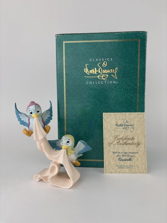 "We'll Tie A Sash Around It" Cinderella Birds Figurine: Walt Disney Classics Collection "We'll Tie A Sash Around It" figurine featuring Birds With Sash from Cinderellea. In original box.