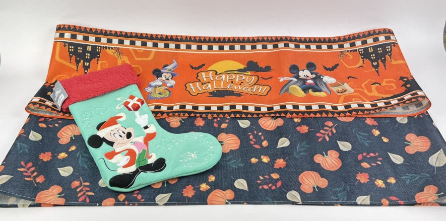 Disney Halloween Table Fabric and Christmas Stocking: Disney Halloween fabric featuring mickey shaped pumpkins and haunted houses and a Disney Christmas Stocking featuring Mickey Mouse