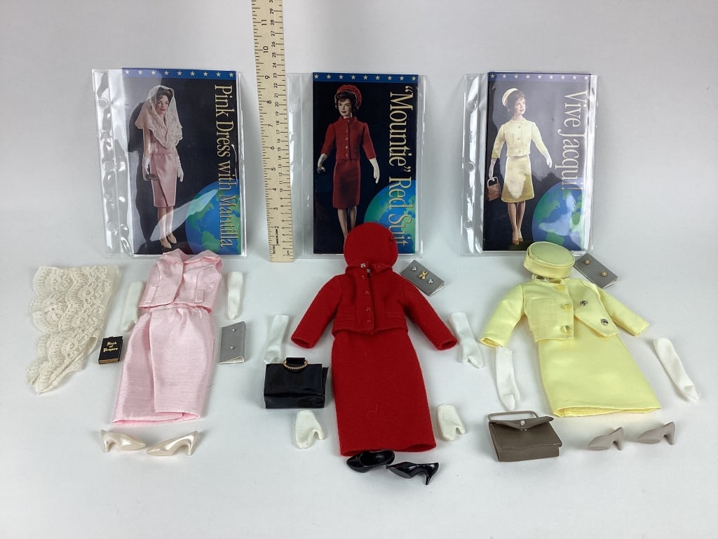 Franklin Mint Doll Jackie Doll Clothes: Franklin Mint Jackie Doll Clothes Sets including France State Visit Vive Jacqui! Suit Ensemble, Visit to Rome and the Vatican Pink Dress with Mantilla, and "Canadian Mountie" Red Suit Ensemble.