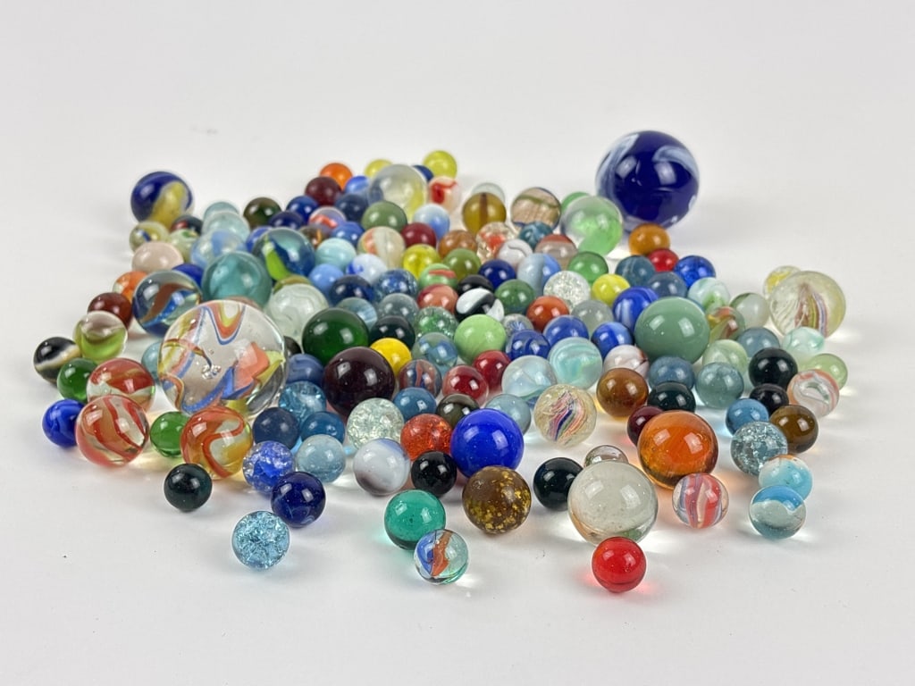 Marbles: Shooters, Glowing, Swirl, Small: Marbles including Vacor Neptune Marble Blue and white swirl shooter, another shooter featuring blue, yellow, and red swirls, marbles that glow under UV light, solid color marbles, and much more