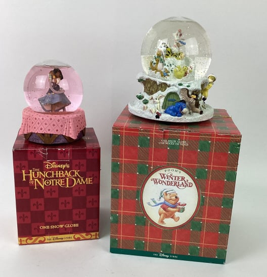 "Winter Wonderland" Winnie the Pooh and "Topsy Turvy" Esmerelda Snowglobes: Disney Store The Hunchback of Notre Dame "Topsy Turvy" Esmerelda Snow Globe and Disney Store Pooh's Winter Wonderland Snow Globe
