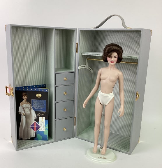 Franklin Mint Jackie Wardrobe: Franklin Mint Jackie Doll Wardrobe. Includes Limited Edition 3424/5000 Jackie Doll (no clothes), COA, stand, hangers, underwear, hose, and a picture of JFK and Jackie.