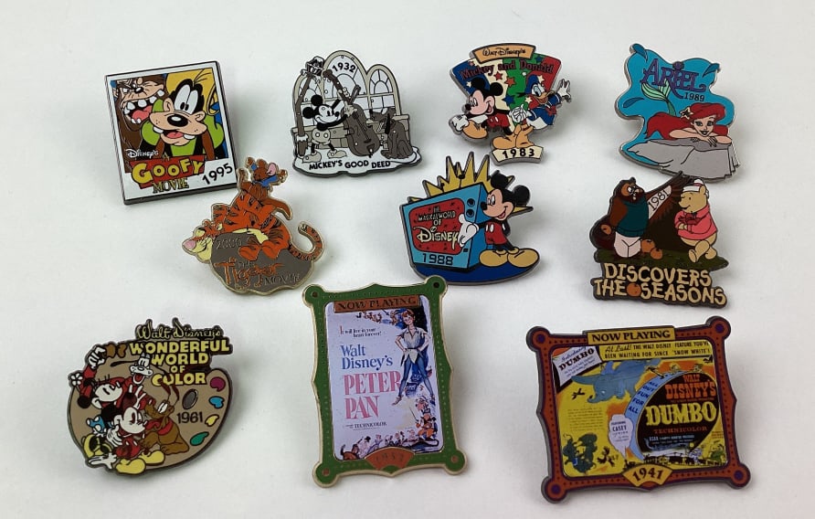 (10) Disney Collector Trader Pins: (10) Disney Collector Trader Pins, including Mickey Mouse, Dumbo, Winnie the Pooh, Goofy, Ariel, Peter Pan, Tigger