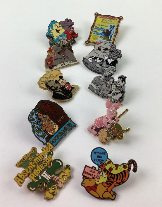 (10) Disney Collector Trader Pins: (10) Disney Collector Trader Pins, including Mickey Mouse, Flounder, Winnie the Pooh, Absent Minded Professor, Lady and the Tramp, Broken Toys, Pocahontas, Piglet, Peter and the Wolf