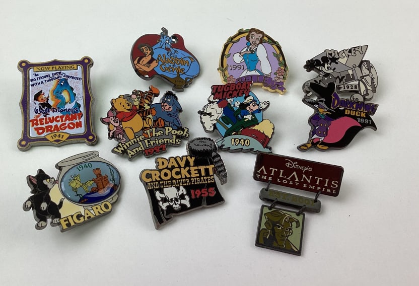 (10) Disney Collector Trader Pins: (10) Disney Collector Trader Pins, Belle, Atlantis, Reluctant Dragon, Winnie the Pooh, Mickey Mouse, Aladdin, Dark Wing Duck, Davy Crockett, Figaro