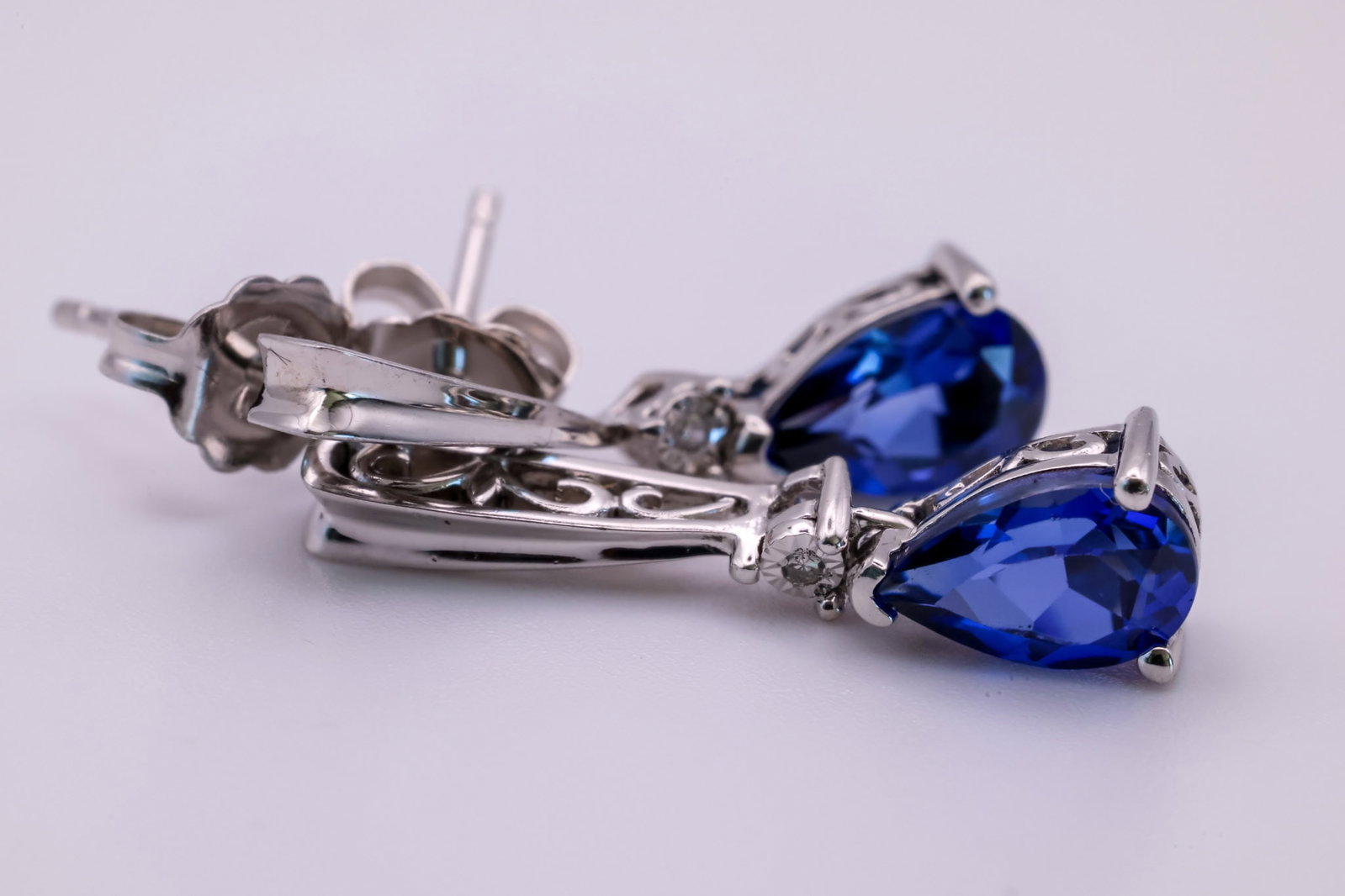 Sapphire Sterling Earrings: Sapphire Sterling Earrings featuring triangle-cut sapphire stones. TW inclusive of all material: 2.50 grams