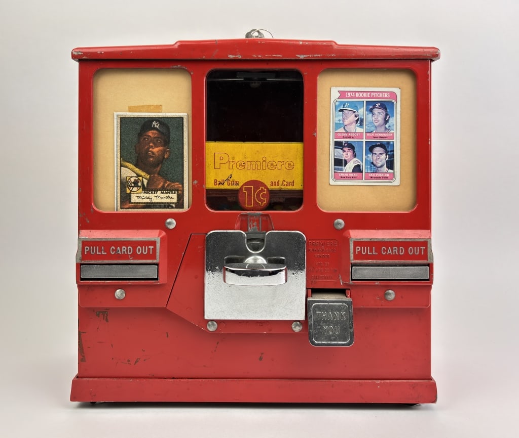 1956 Coin-Op Oak Premiere Baseball Trading Card & Gumball Vending Machine: 1956 Coin-op Oak Premiere Baseball Trading Card & Gumball Vending Machine. VG Condition. Comes with 2 sets of keys. Gumballs dispense but cards do not. Measures 13"x5.5"x13" One Cent Machine