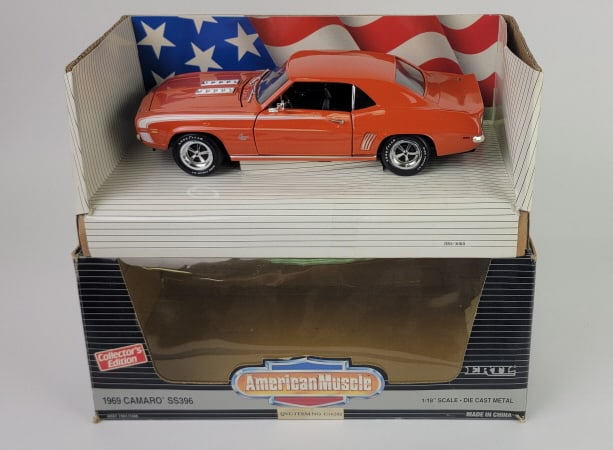 American Muscle Diecast 1/18 Scale 1969 Camaro: 1993 American Muscle ERTL Diecast 1/18 Scale Collector's Edition 1969 Camaro SS396. Features steerable wheels, opening doors and hood, detailed chassis, complete interior, 375 hp 396 cubic inch V-8 wi
