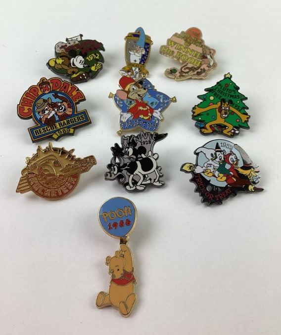 (10) Disney Collector Trader Pins: (10) Disney Collector Trader Pins, including Pluto, Winnie the Pooh, Chip N Dale, Timothy, Merlin, Rocketeer, Mickey Mouse