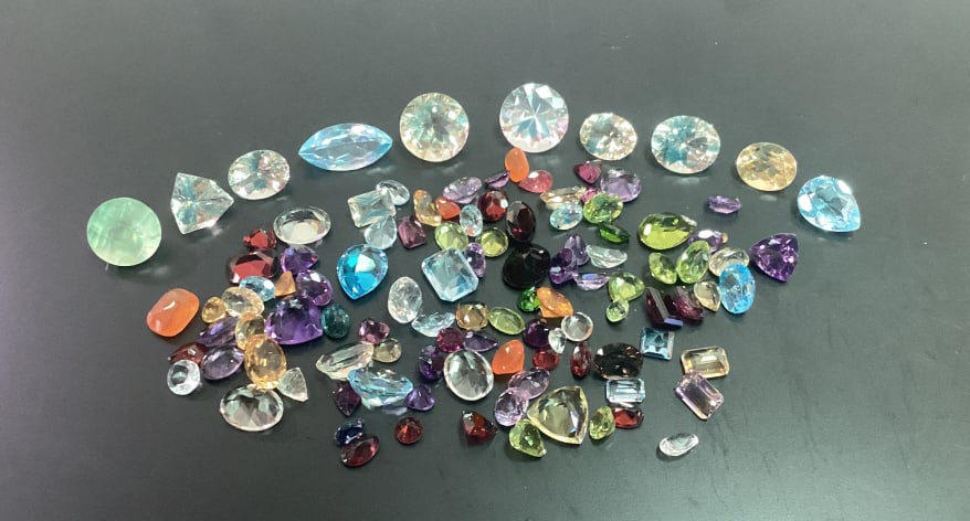 Loose Gemstones incl. Fire Opal etc..: Loose Gemstones incl. Fire Opal, Aquamarine, Garnet, and more. Gemstones come in different cuts, sizes, and colors.