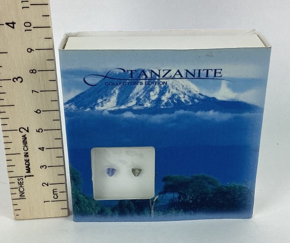 Loose Tanzanite Gemstones: Loose Tanzinite Gemstones in a box, 5x5MM, one brown, one purple, both triangle cut, .75CTW